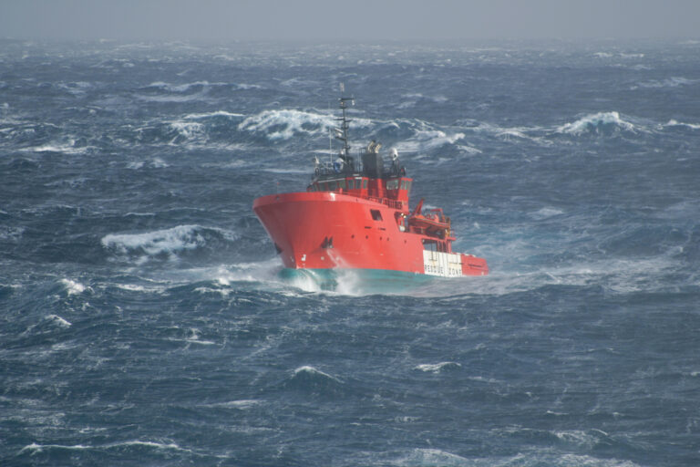 Ship in stormy ocean waters